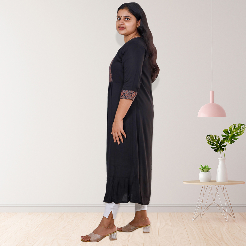 Anjali wringle reyon with ajrakh cotton black with small floral patch top Anjali wringle reyon with ajrakh cotton black with small floral patch top
