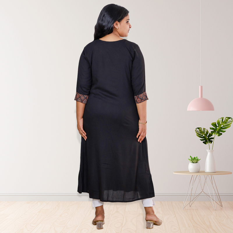 Anjali wringle reyon with ajrakh cotton black with small floral patch top Anjali wringle reyon with ajrakh cotton black with small floral patch top