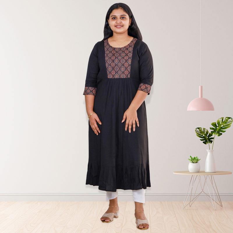 Anjali wringle reyon with ajrakh cotton black with small floral patch top Anjali wringle reyon with ajrakh cotton black with small floral patch top